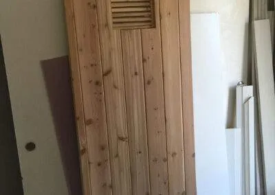 Sauna door built by clarke construction projects