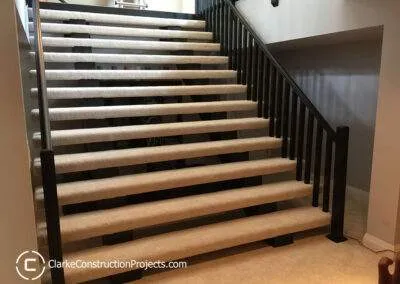 beautiful basement stairs built by clarke construction projects