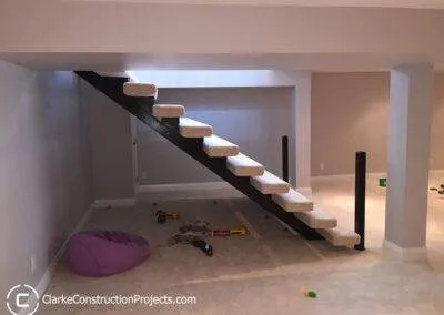 double wide floating staircase by clarke construction projects