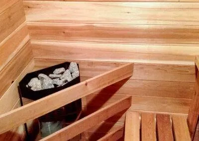 Sauna heater with stones installed by clarke construction projects