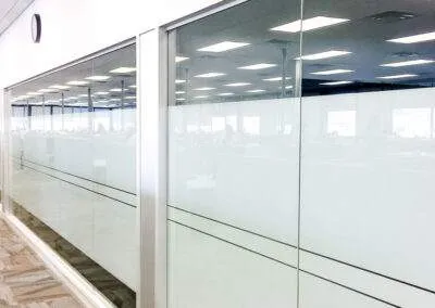 Glass wall installation by clarke construction projects